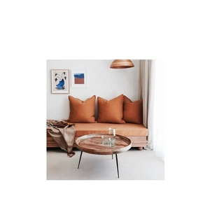 Detailed view of warm terracotta soft cushions and modern home decor for living rooms