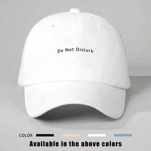 White cotton baseball cap featuring Do Not Disturb embroidery with adjustable strap back