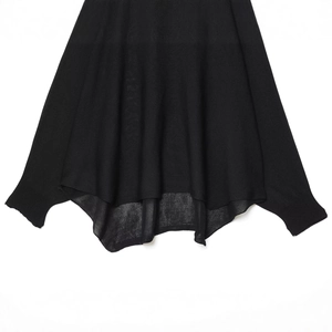 Women's black knit sweater with oversized batwing sleeves and asymmetrical flowy hem
