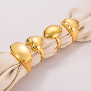 Set of four minimalist gold stainless steel geometric rings in heart and oval shapes