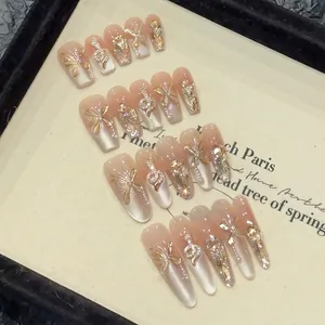 Luxury press-on nails with 3D gold butterfly and silver snake relief on nude pink base
