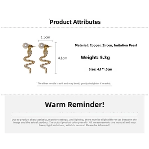 Detailed view of gold-plated snake earrings with pearls and zircon measurements