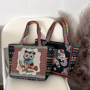 Ethnic embroidered canvas tote bags with owl and elephant patterns and woven handles