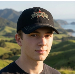 Close-up of black cotton baseball cap with embroidered green Ranger logo and red star