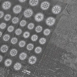 Detail of ultra-thin snowflake nail stickers with hollow designs and model TO-2656