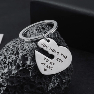 Detail of silver heart key keychain with You Hold The Key To My Heart engraving