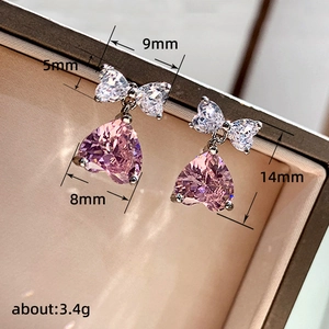 Pink heart bow drop earrings in silver finish with dimensions and weight specs