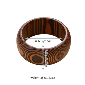 Detailed view of zebra wood grain bangle with 6.7cm inner diameter and 3.5cm width