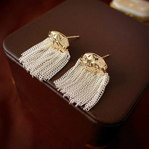Short chain tassel earrings with gold hammered metal and silver fringe details