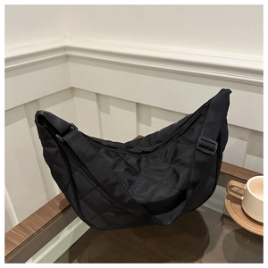 Minimalist black quilted hobo shoulder bag with adjustable strap in semi-glossy nylon
