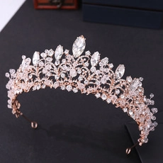 Detailed macro view of rose gold bridal crown with crystal vine and flower patterns
