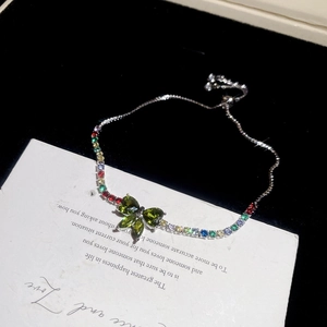 Detailed view of silver butterfly bracelet with colorful crystals and adjustable slider