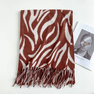 Close-up of zebra pattern winter scarf with soft fringes and wool texture