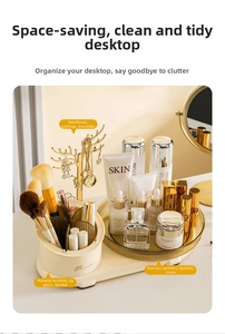 Rotating makeup organizer with gold jewelry tree and tiered cosmetic storage compartments