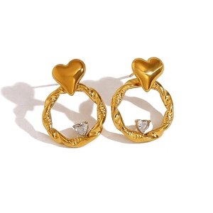 Polished gold twisted hoop earrings with heart-shaped crystal pendant for women