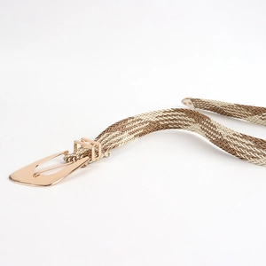 Detail of hand-woven straw belt with irregular gold metal buckle for women