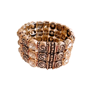 Vintage rose gold stretch bracelet featuring three rows of sparkling crystals and scrollwork