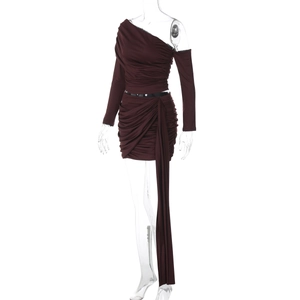 Detail view of burgundy one-shoulder mini dress with ruched fabric and side drape