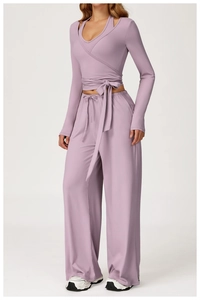 Detail of lavender wrap long sleeve yoga top and matching high waist wide leg pants