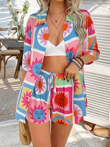 Detail shot of bohemian two-piece set featuring colorful sun face mosaic print