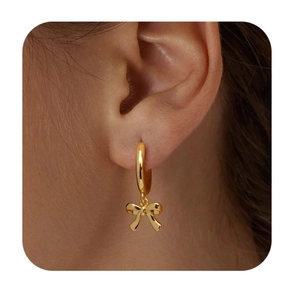 Chic 18K gold plated brass hoop earrings with a cute bow pendant shown on a model