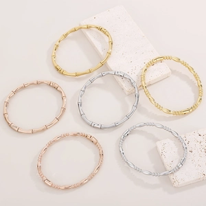Bamboo style 18K gold plated stainless steel bangles set in gold, silver, and rose gold