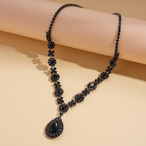 Detailed view of vintage gothic flower necklace with black rhinestone water drop pendant