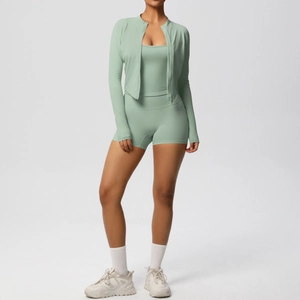 Detail view of mint green high-elastic yoga set with zip jacket, vest and slim fit shorts