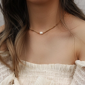 Elegant gold Cuban chain necklace with white freshwater pearl pendant on model