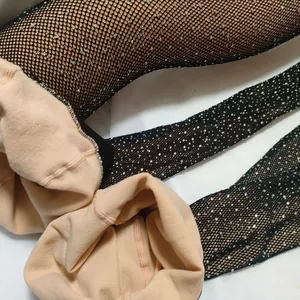 Fleece lined fishnet leggings with colorful rhinestones and thermal nude inner layer