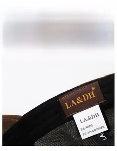 Detail of baseball cap interior showing widened sweatband and 80% cotton brand label
