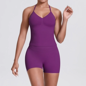 Detailed view of seamless high-waisted shorts and racerback tank top in dark purple