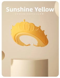 Detail view of the crown-shaped baby bath cap in sunshine yellow with adjustable buckle