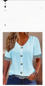 Detail of light blue V-neck top showing textured hollow fabric and dark lace trim sleeves