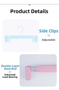 Detail of adjustable non-slip pant hangers with double steel rods and sliding clips
