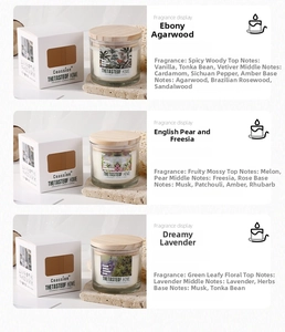 Detail of aromatherapy candle set with wood lids showing scent notes and packaging
