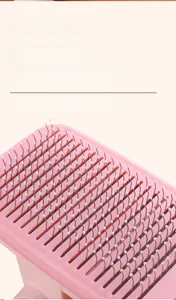 Close-up of pink pet brush with resin adhesive protection points and metal needles