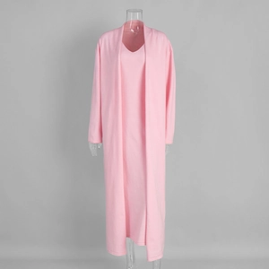 Detail of pink knitted two-piece set featuring long cardigan and v-neck maxi dress