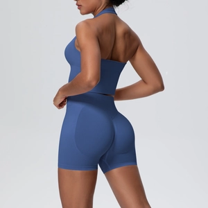 Rear view of seamless navy blue yoga set featuring halter top and scrunch butt shorts