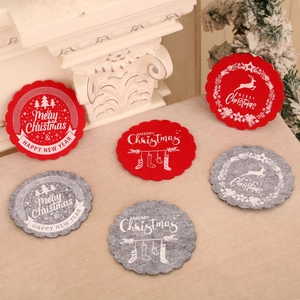 Red and grey felt Christmas coasters with scalloped edges and festive holiday designs