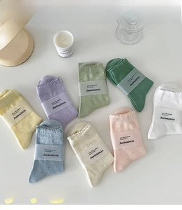 Set of 8 colorful hollow knit mid-calf socks with ruffle trim and breathable dot patterns