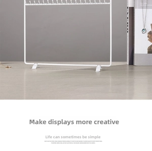 White minimalist iron jewelry display stand for necklaces and bracelets on a table