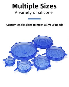 Detail view of 6-piece blue silicone stretch lids with smile pattern and pull tabs