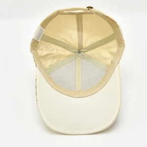 Detail view of cotton baseball cap interior showing stitching and 100% cotton label