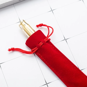 Thick red velvet drawstring pouch for single pen storage with gold pen accessory