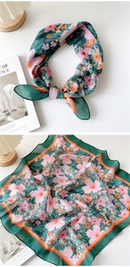 Detailed macro view of vintage floral print cotton scarf with orange contrast piping edge