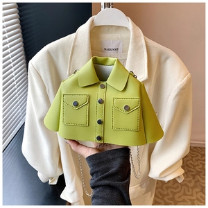 Close-up of creative lime green jacket-shaped crossbody bag with silver chain strap detail