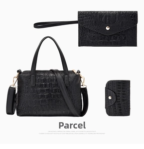 Detailed set of black crocodile embossed handbag, clutch and card holder with gold hardware