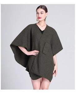 Detail of dark army green wool poncho jacket with loose knit cardigan fit and draped hem