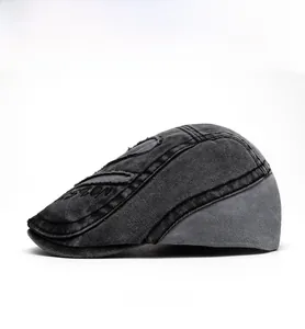 Side view of washed denim newsboy cap featuring vintage NO.25 embroidery and patchwork